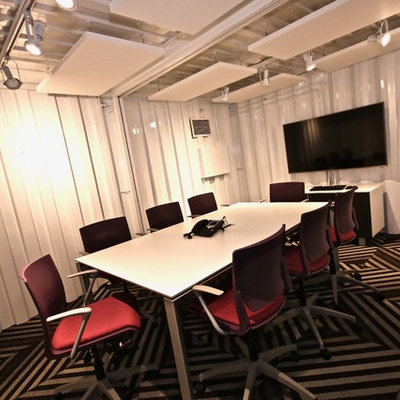 Home office - industrial home office idea in Las Vegas with white walls