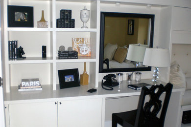 Example of a transitional home office design in Vancouver with white walls
