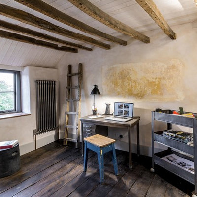 Example of a small farmhouse freestanding desk dark wood floor home office design in Other with multicolored walls