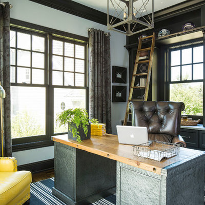 Inspiration for a transitional freestanding desk dark wood floor home office remodel in Minneapolis with gray walls