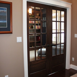 Mid-sized arts and crafts built-in desk carpeted study room photo in Other with blue walls