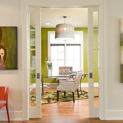 Inspiration for a contemporary freestanding desk medium tone wood floor home office remodel in Minneapolis with green walls