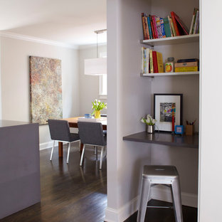 Example of a small trendy built-in desk dark wood floor study room design in Atlanta with gray walls and no fireplace
