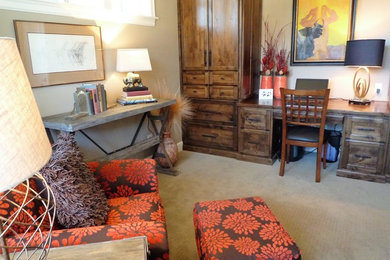 Example of a small transitional built-in desk carpeted study room design in Portland with brown walls