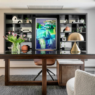 This is an example of a large contemporary study room in Sydney with grey walls, carpet, a freestanding desk and beige floor.