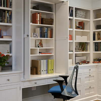 Inspiration for a timeless built-in desk home office remodel in New York with white walls