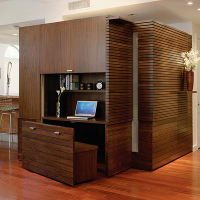 Inspiration for a contemporary built-in desk medium tone wood floor study room remodel in New York