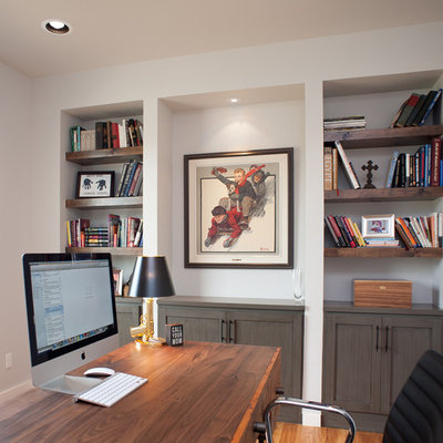 Mid-sized trendy freestanding desk light wood floor study room photo in Oklahoma City with white walls and no fireplace