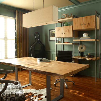 Example of a mid-sized eclectic freestanding desk medium tone wood floor and brown floor home studio design in Atlanta with green walls and no fireplace