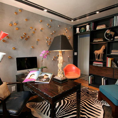 Inspiration for an eclectic freestanding desk medium tone wood floor home office remodel in Charleston with gray walls