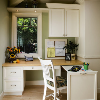 Elegant built-in desk home office photo in San Francisco