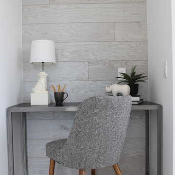 Office Nook with Gray Paneling and Wall Sconce
