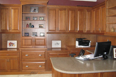 Mid-sized elegant built-in desk home office photo in Other