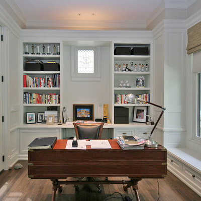 Example of a mid-sized classic freestanding desk medium tone wood floor study room design in Chicago with gray walls