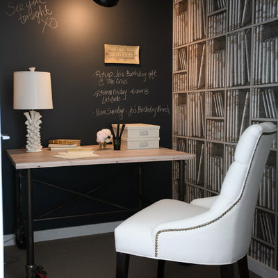 Inspiration for a timeless freestanding desk carpeted home office remodel in Vancouver with black walls