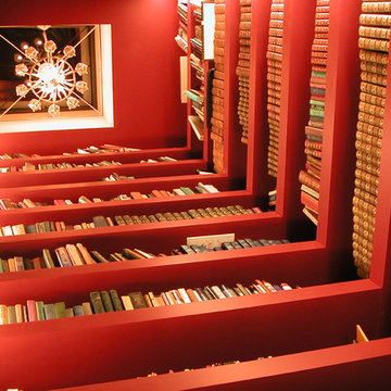 Open elevator shaft doubles as two-story library.
