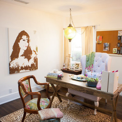Home office - eclectic freestanding desk dark wood floor home office idea in Los Angeles with white walls