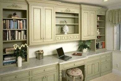 Mid-sized elegant built-in desk carpeted and beige floor study room photo in DC Metro with no fireplace and beige walls