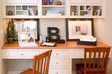 This is an example of a small traditional home office in Other with a reading nook, grey walls, light hardwood flooring, no fireplace and a built-in desk.