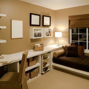 Example of a transitional built-in desk carpeted craft room design in Nashville with brown walls and no fireplace
