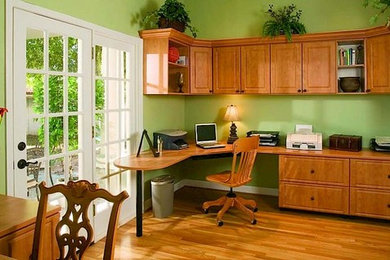 Example of a transitional home office design in Edmonton