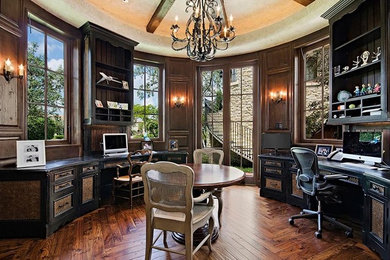 Large elegant freestanding desk dark wood floor home office photo in Salt Lake City