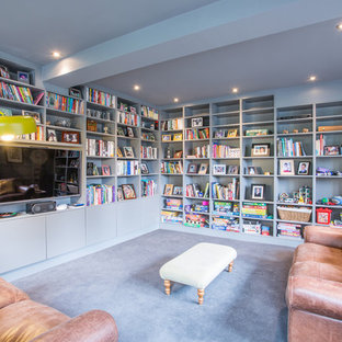 This is an example of a medium sized contemporary home office in Surrey with grey walls, carpet and grey floors.