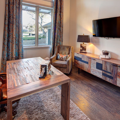 Inspiration for a mid-sized contemporary freestanding desk dark wood floor and brown floor study room remodel in Austin with beige walls