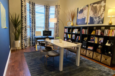 Example of a transitional home office design in Austin