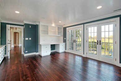 Example of a dark wood floor and brown floor home office design in Atlanta