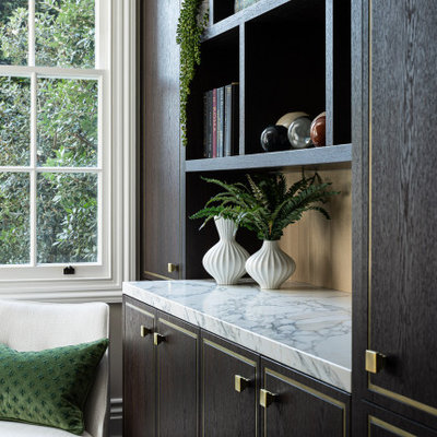 Inspiration for a mid-sized timeless built-in desk medium tone wood floor and green floor study room remodel in London with beige walls