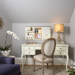 Elegant freestanding desk medium tone wood floor home office photo in Minneapolis with gray walls