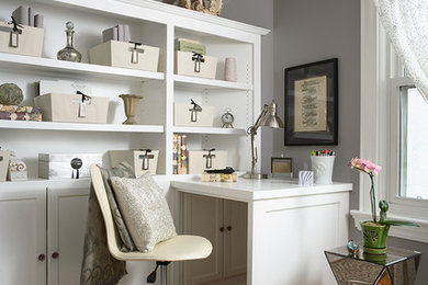 Inspiration for a transitional built-in desk medium tone wood floor study room remodel in Charlotte with gray walls
