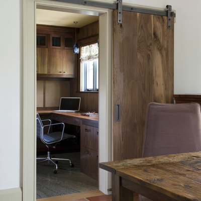 Inspiration for a rustic home office remodel in Boston with white walls