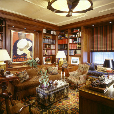 Example of a classic freestanding desk medium tone wood floor home office design in New York
