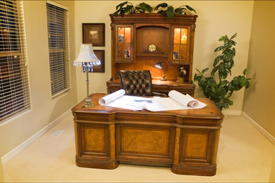 Photo of a small bohemian study in Salt Lake City with beige walls, carpet and a freestanding desk.