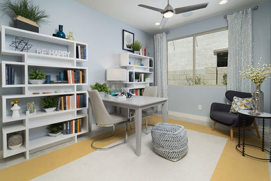 Inspiration for a mid-sized contemporary freestanding desk ceramic tile and beige floor study room remodel in Phoenix with blue walls