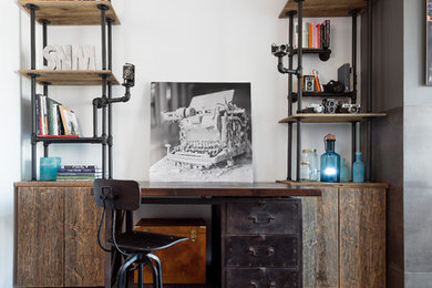 Home studio - industrial freestanding desk medium tone wood floor home studio idea in Toronto with white walls