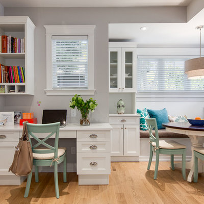 Inspiration for a mid-sized transitional built-in desk light wood floor study room remodel in Vancouver with gray walls and no fireplace