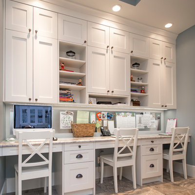 Example of a mid-sized transitional built-in desk ceramic tile study room design in Calgary with gray walls and no fireplace