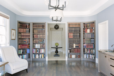 Inspiration for a large transitional dark wood floor and brown floor home office library remodel in Chicago with blue walls