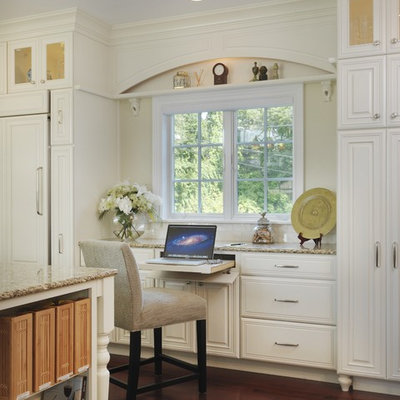Inspiration for a timeless built-in desk medium tone wood floor study room remodel in Providence with white walls