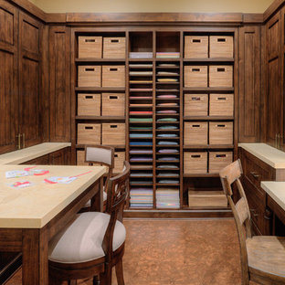 Example of a huge transitional built-in desk ceramic tile craft room design in Salt Lake City with brown walls
