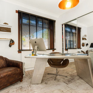 Photo of a large classic home office in Other with white walls, a freestanding desk and beige floors.