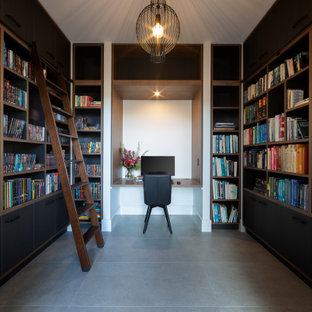 Design ideas for a contemporary home office in Canberra - Queanbeyan with white walls, a built-in desk and grey floor.