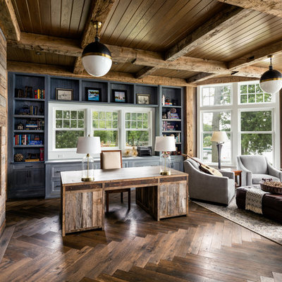 Study room - farmhouse freestanding desk dark wood floor study room idea in Milwaukee with gray walls, a wood fireplace surround and a ribbon fireplace