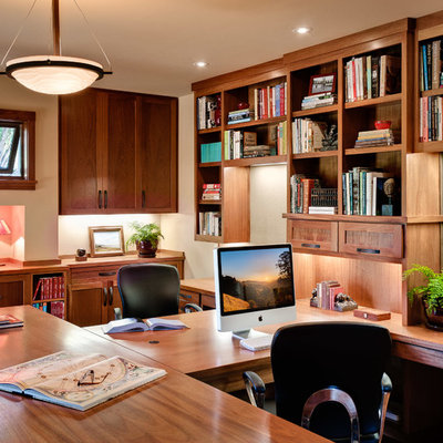 Example of a classic built-in desk home office design in San Francisco with beige walls
