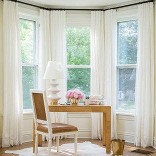 Study room - small victorian freestanding desk medium tone wood floor study room idea in Chicago with white walls