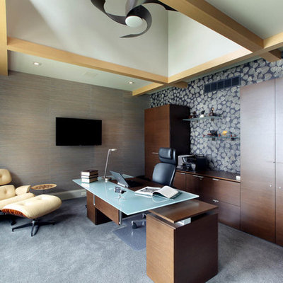 Example of a mid-sized trendy freestanding desk carpeted study room design in Grand Rapids with multicolored walls