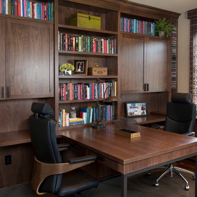 Inspiration for a mid-sized contemporary built-in desk dark wood floor study room remodel in San Diego with beige walls